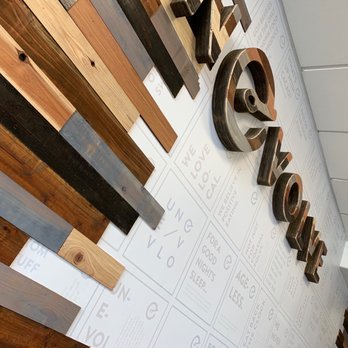 everbowl - the name of a wood paneled wall - Acai Bowls Near Me - Carlsbad, California
