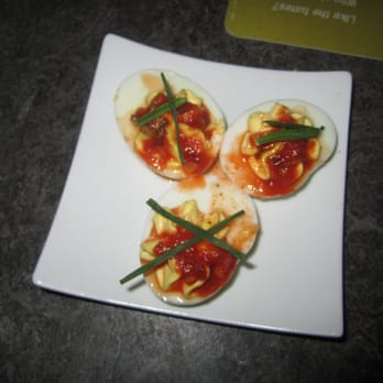 Yard House - Deviled Eggs topped with spicy tomato sauce, sweet chili sauce & chive batons - Bars Near Me - Glenview, Illinois Yard House - Deviled Eggs topped with spicy tomato sauce, sweet chili sauce & chive batons - Bars Near Me - Glenview, Illinois