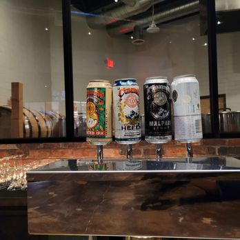 Albuquerque Distilling - several cans of beer on a counter - Distilleries Near Me - Albuquerque, New Mexico