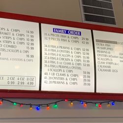 Anchors Fish & Chips - 12/23/2022: Anchors Fish & Chips' full menu located above cash register.