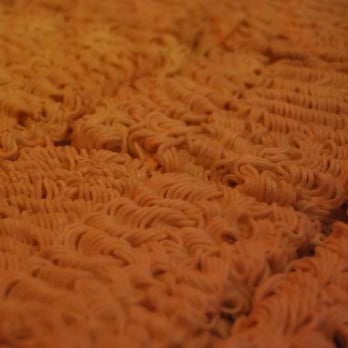 IPPUDO NY - the ramen underneath the glass bar countertop - Ramen Near Me - New York, New York