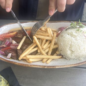 La Costanera - Husband very happy with his lomo saltado. - Peruvian Near Me - Half Moon Bay, California La Costanera - Husband very happy with his lomo saltado. - Peruvian Near Me - Half Moon Bay, California
