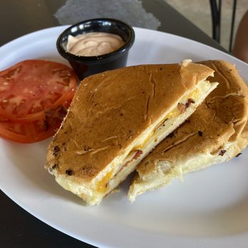 The Tiny Turtle - Four cheese bacon melt with tomato and creme caribe on the side - sandwich only - Caribbean Near Me - Cocoa Beach, Florida The Tiny Turtle - Four cheese bacon melt with tomato and creme caribe on the side - sandwich only - Caribbean Near Me - Cocoa Beach, Florida