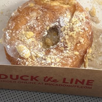 Duck Donuts - Toppings downing into the greasy donut covered in hot frosting. - Donuts Near Me - Johnstown, Colorado Duck Donuts - Toppings downing into the greasy donut covered in hot frosting. - Donuts Near Me - Johnstown, Colorado
