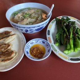 Shrimp dumpling noodle soup with pan fried dumplings and Chinese greens (and chilli oil). Shrimp dumpling noodle soup with pan fried dumplings and Chinese greens (and chilli oil).
