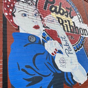 Highland Tavern - a mural of a woman drinking a soda - Bars Near Me - Denver, Colorado