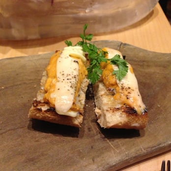 Jaleo - Sea urchin over toast topped with butter - Spanish Near Me - Washington, DC, District of Columbia