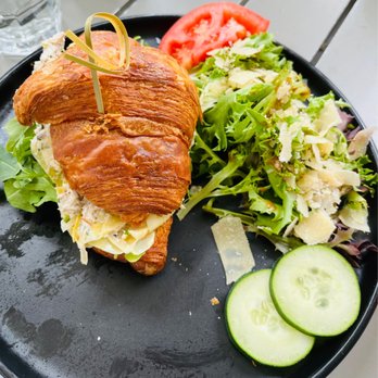 Sugar and Scribe - Artichoke Chicken salad croissant sandwich with side salad - Bakeries Near Me - La Jolla, California Sugar and Scribe - Artichoke Chicken salad croissant sandwich with side salad - Bakeries Near Me - La Jolla, California