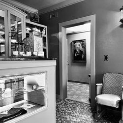Chrome Comb Barbershop - The classic waiting area with historical decor.