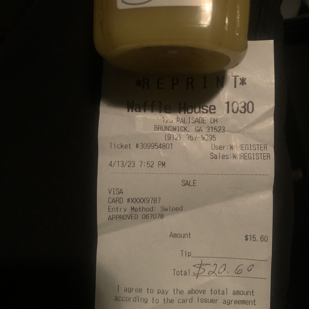 a receipt and a bottle of ketchup a receipt and a bottle of ketchup