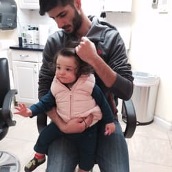 Lice Busters - 14-month old at her follow up. Sitting patiently while yonnie checks her hair.