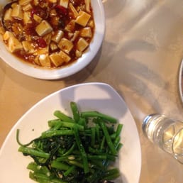 Vegetarian ma-po tofu and morning glory stir-fried with garlic