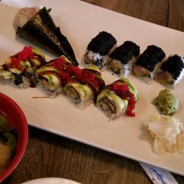 Miso Soup, Tuna Roll, Dragon Roll, and Black Yellowtail Roll Miso Soup, Tuna Roll, Dragon Roll, and Black Yellowtail Roll