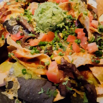 Yard House - chicken nachos, with skirt steak replacing the chicken . . . - New American Near Me - West Nyack, New York Yard House - chicken nachos, with skirt steak replacing the chicken . . . - New American Near Me - West Nyack, New York