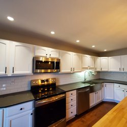 Wise Construction - A simple white backsplash created an elegant upgrade for this kitchen.