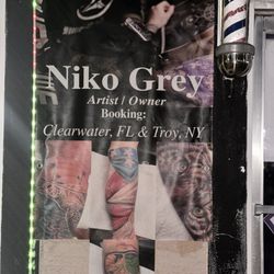 The NY Tattoo Gallery - Owners banner outside the shop