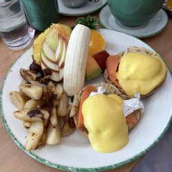 Cora - Salmon eggs benedict with potatoes and fruit salad