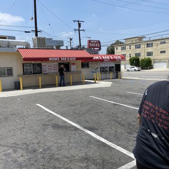 Mom's Bar-B-Que - ows a man standing in a parking lot - Barbeque Near Me - Los Angeles, California