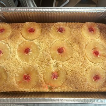 Sweet Tooth Creations - a pineapple cake in a pan - Desserts Near Me