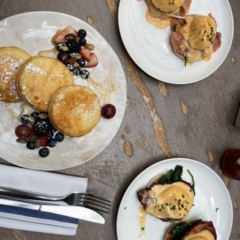 NOMO Kitchen - the Brunch Lemon, Ricotta, Pancakes Mixed Berries, Candied Pistachios, Maple Syrup - New American Near Me - New York, New York