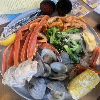 Tortuga's Lie - Full steamer. Crab legs, clams, veggies, and shrimp, all garnished with cheese. - Seafood Near Me - Nags Head, North Carolina Tortuga's Lie - Full steamer. Crab legs, clams, veggies, and shrimp, all garnished with cheese. - Seafood Near Me - Nags Head, North Carolina