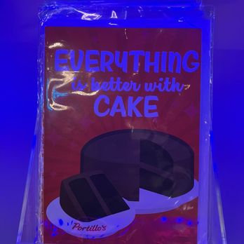 Portillo's Grapevine - Birthday card - A sign displays the phrase "Everything is better with cake" with a cake illustration, illuminated by blue lighting, and includes the Portillo's logo. - Salad Near Me - Grapevine, Texas