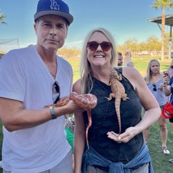 Deb's Dragons Interactive Wildlife Encounters - ROB LOWE and our wrangler Kristy, holding our animals at the DODGER FEAR FACTOR event