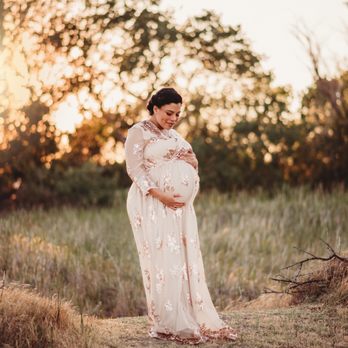 So Dashing Photography - Expecting Mother in a beautiful gold sequin color Dress posing for Maternity Photos at sunset. - Session Photography Near Me So Dashing Photography - Expecting Mother in a beautiful gold sequin color Dress posing for Maternity Photos at sunset. - Session Photography Near Me