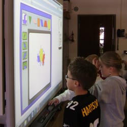 Aquinas Catholic Schools - St. Patrick students using SmartBoard technology.