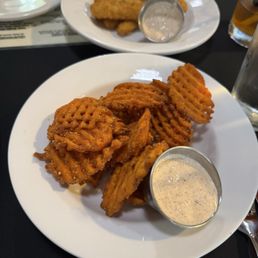 Sweet potato fries + calamari fries with trap sauce
