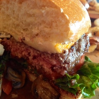 Whiskey Cake - The OMG burger cooked medium rare and the huge onion ring on the side. - New American Near Me - Plano, Texas Whiskey Cake - The OMG burger cooked medium rare and the huge onion ring on the side. - New American Near Me - Plano, Texas
