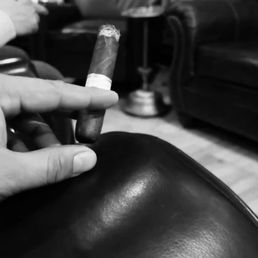 a person smoking a cigarette in a living room