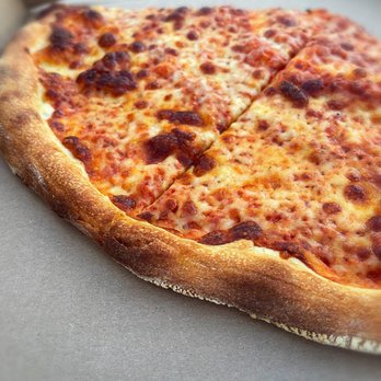 Pizza Pizzazz - Pizza by the slice (cheese) - A cheese pizza with a golden, crispy crust and melted cheese, served in a pizza box. - Pizza Near Me - Danielson, Connecticut
