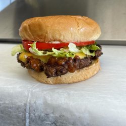 Old 131 Burger - Old 131 burger. Locally sourced beef, smothered with American cheese, chili sauce, and served deluxe  on a toasted brioche bun.