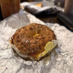 Coffee Talk - Bacon, egg, cheddar cheese, & hash brown on toasted everything bagel.