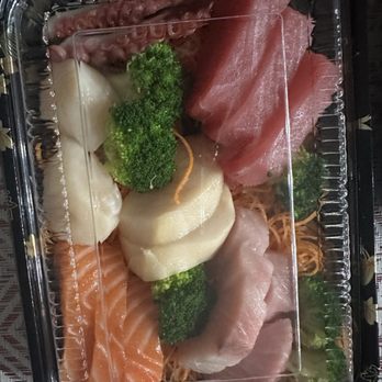 Sashimi Fusion - a variety of sashimis in a plastic container - Sushi Bars Near Me - Davenport, Florida Sashimi Fusion - a variety of sashimis in a plastic container - Sushi Bars Near Me - Davenport, Florida