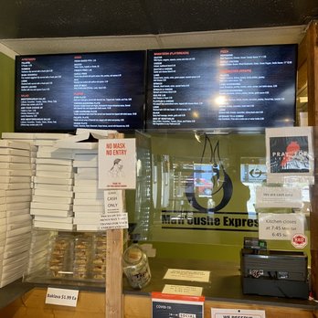 Man'oushe Express - Ordering counter with menu. Bring cash! It's cash only... they have an ATM machine - Pizza Near Me - Seattle, Washington