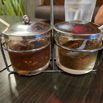 The Asian Bistro - Table chili sauce and pepper - Thai Near Me - San Diego, California