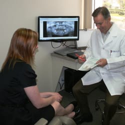Newport Oral Surgery - This is Doctor Michaelis consulting with a patient
