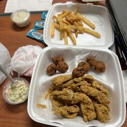 Catfish nuggets, fries, hush puppies and coleslaw