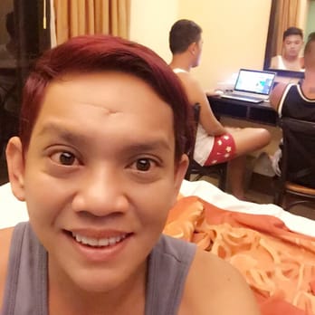 Microtel Inn & Suites - With my cousins working while I take a selfie! - Hotels Near Me - Malay, AKL
