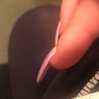 Lily's Nails And Spa - Pink polish on the side showing through due to nail tech filing trying to shape the nail AFTER applying the holographic dust. - Nail Salons Near Me - Alhambra, California