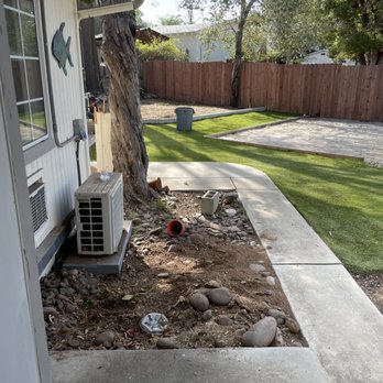 Angel Tree Care - Stump removed!! There used to be a tree stump by this AC unit - Tree Services Near Me