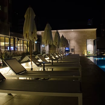 NEXT Hotel Brisbane - Pool deck at night. - Hotels Near Me - Brisbane, QLD
