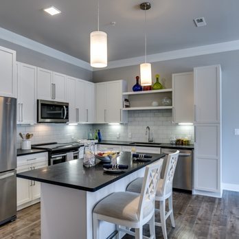 The Barton - White shaker cabinets and honed granite countertops! - Apartments Near Me - Clayton, Missouri The Barton - White shaker cabinets and honed granite countertops! - Apartments Near Me - Clayton, Missouri