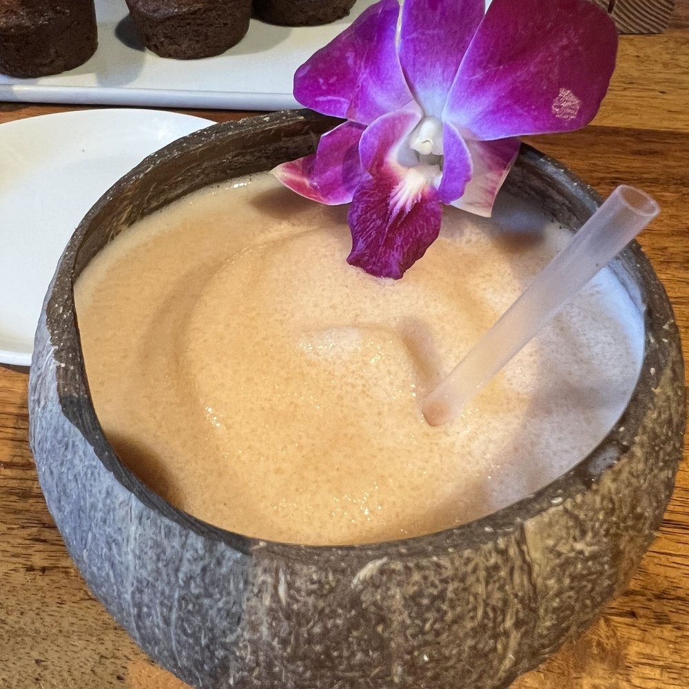 Keoki's Paradise - Lina colada in souvenir shell. - Seafood Near Me - Koloa, Hawaii