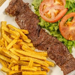 Truco de Güin Arecibo - Nuestro sabroso churrasco al plato, con un acompañante, y ensalada.