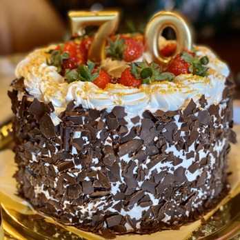 Amaretti Desserts - Vanilla & Chocolate layer cake with chocolate mousse filling, topped with Strawberries... so good!! - Desserts Near Me - Jacksonville, Florida