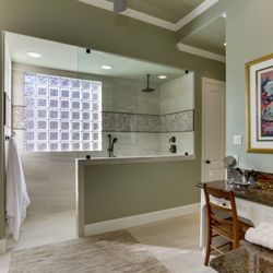 The Residence Doctor - This shower was also completely redone with a new rain shower head, a new shower bench, and new tile for walls and floor.