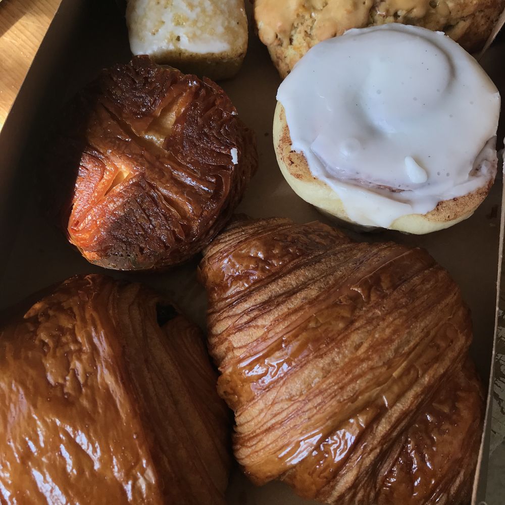 Knead Artisan Bakery - From the top; lemon EVO, orange-apricot scone, cinnamon roll, butter croissant, pain au chocolat, Queen Aman - Bakeries Near Me - San Diego, California Knead Artisan Bakery - From the top; lemon EVO, orange-apricot scone, cinnamon roll, butter croissant, pain au chocolat, Queen Aman - Bakeries Near Me - San Diego, California